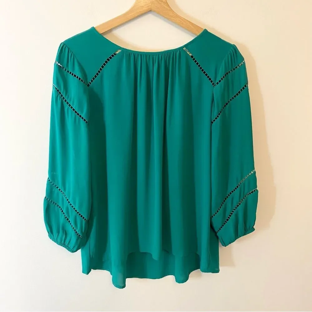 Ann Taylor Loft green jewel toned blouse with cut out detail size S.